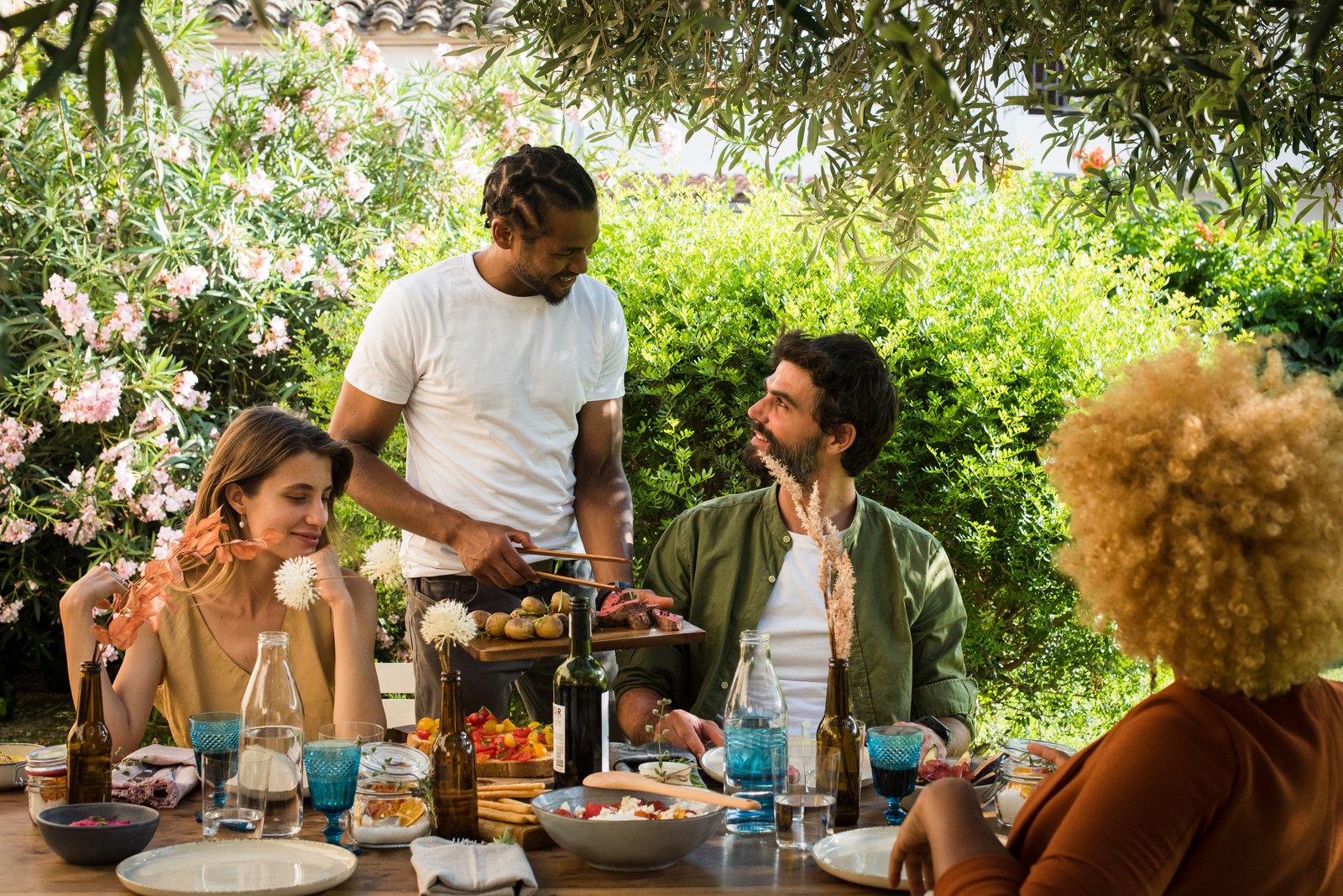 Group of Friends Eating Together Outdoors